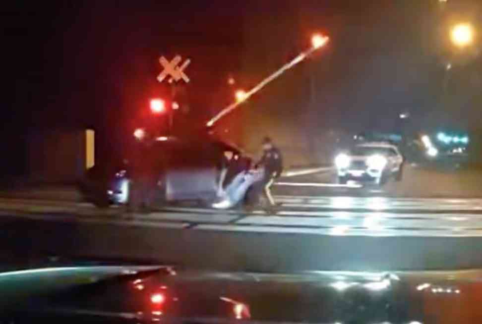 HEROIC RESCUE: PISCATAWAY COPS PULL IMPAIRED DRIVER FROM CAR SECONDS BEFORE TRAIN COLLISION
